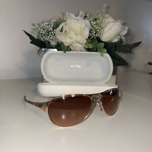 Oakley Restless Gretchen Bleiler Women's Gold Frame Brown Lens Sunglasses